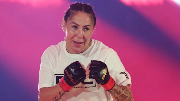 Cris Cyborg walks out ahead of the Women's Featherweight World Title fight.