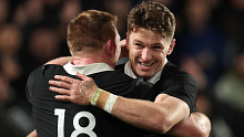 Beauden Barrett and Fletcher Newell celebrate New Zealand's win. 