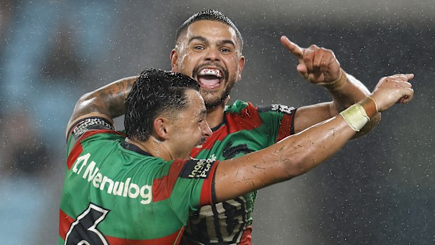 Latrell Mitchell celebrates after scoring a try.