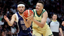 Dante Exum of Australia drives to the basket past Devin Booker of the United States.