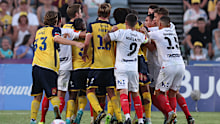 Players tussle during the A-League match between Central Coast Mariners and Melbourne City.