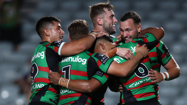 Dion Teaupa of the Rabbitohs celebrates scoring a try with teammates during the South Sydney Rabbitohs and the Manly Sea Eagles at Industree Group Stadium on February 10, 2023 in Gosford, Australia. (Photo by Jason McCawley/Getty Images)