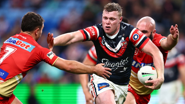 Drew Hutchison of the Roosters fends during the round 24 NRL match between Sydney Roosters and Dolphins at Allianz Stadium on August 12, 2023 in Sydney, Australia. (Photo by Jeremy Ng/Getty Images)