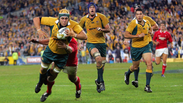 Stephen Hoiles of the Wallabies dives in for the winning try against Wales.
