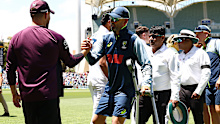 Nathan Lyon embraces England players at the Adelaide Oval. 