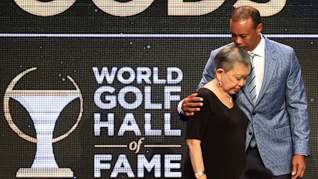 Tiger Woods and his mother Kultida Woods react as they pose for photos prior to his induction at the 2022 World Golf Hall of Fame Induction at the PGA TOUR Global Home on March 09, 2022 in Ponte Vedra Beach, Florida. (Photo by Sam Greenwood/Getty Images)