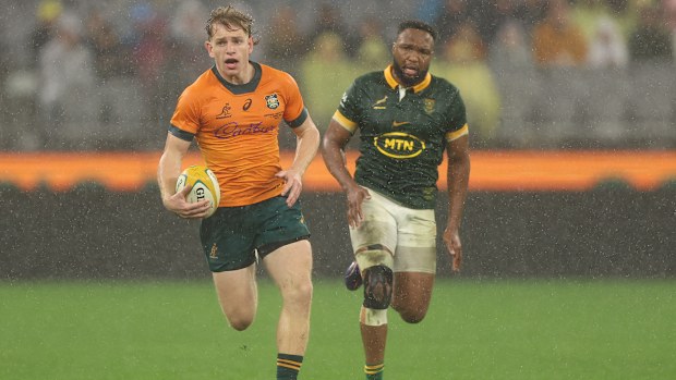 Max Jorgensen of the Wallabies runs the ball.