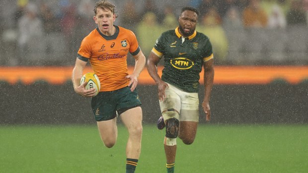 Max Jorgensen of the Wallabies runs the ball.