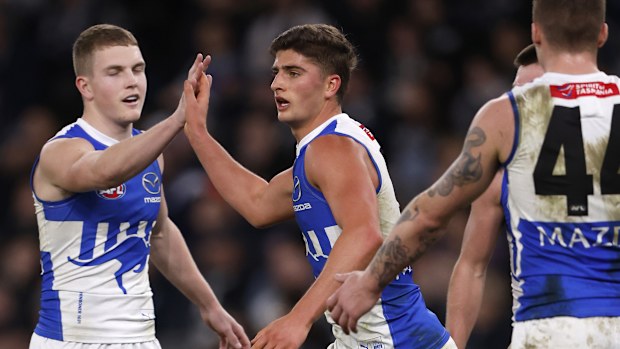 Harry Sheezel of the Kangaroos celebrates a goal.