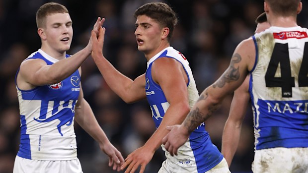 Harry Sheezel of the Kangaroos celebrates a goal.