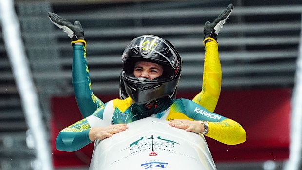 Bree Walker and Kiara Reddingius react after completing their final run of the two-woman bobsligh final at Milano Cortina 2026.