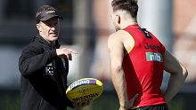 MELBOURNE, AUSTRALIA - MAY 05: Damien Hardwick, Senior Coach of the Tigers is seen speaking to Noah Balta of the Tigers during the Richmond Tigers training session at Punt Road Oval on May 05, 2021 in Melbourne, Australia. (Photo by Dylan Burns/AFL Photos)