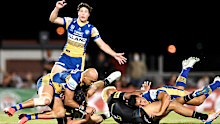 Blake Ferguson of the Eels tackles Matt Burton of the Panthers.