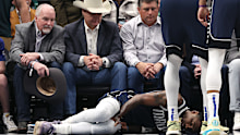 Irving lies on the court after suffering an injury in the first half against the Sacramento Kings at American Airlines Center on March 03, 2025 in Dallas, Texas. NOTE TO USER: User expressly acknowledges and agrees that, by downloading and/or using this photograph, user is consenting to the terms and conditions of the Getty Images License Agreement. (Photo by Sam Hodde/Getty Images)