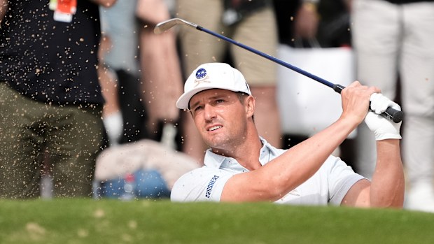 Bryson DeChambeau of Crushers GC plays out of the bunker on the 11th hole during LIV Adelaide at The Grange Golf Club.
