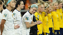 Rapinoe was all smiles before the shootout begun.