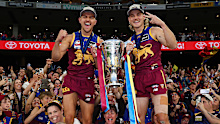 Brisbane Lions players celebrate after the 2025 grand final.