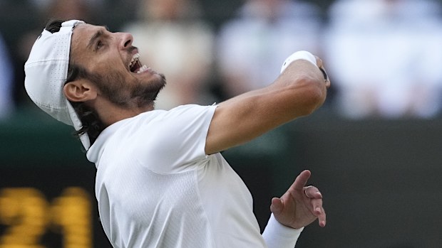 Lorenzo Musetti of Italy celebrates after defeating Taylor Fritz of the United States.