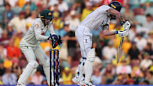 Alex Carey takes a catch to dismiss Ben Stokes. 
