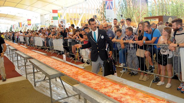 The pizza measured in at one and a half kilometres long which beat the record previously set by Spain. (AAP)