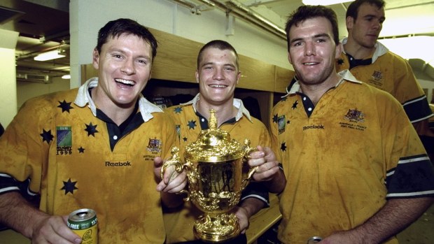 Matt Burke, Ben Tune ve Owen Finegan of Australia.