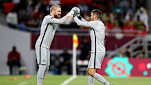 DOHA, QATAR - JUNE 13: Andrew Redmayne of Australia interacts with Mathew Ryan of Australia during the 2022 FIFA World Cup Playoff match between Australia Socceroos and Peru at Ahmad Bin Ali Stadium on June 13, 2022 in Doha, Qatar. (Photo by Mohamed Farag/Getty Images)