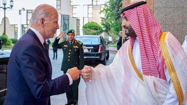 In this image released by the Saudi Royal Palace, Saudi Crown Prince Mohammed bin Salman, right, greets President Joe Biden with a fist bump after his arrival at Al-Salam palace in Jeddah, Saudi Arabia, Friday, July 15, 2022. (Bandar Aljaloud/Saudi Royal Palace via AP)