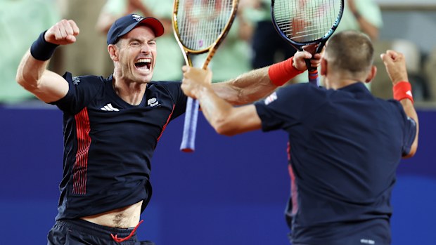 Andy Murray of Team Great Britain celebrates with partner Dan Evans in Paris.