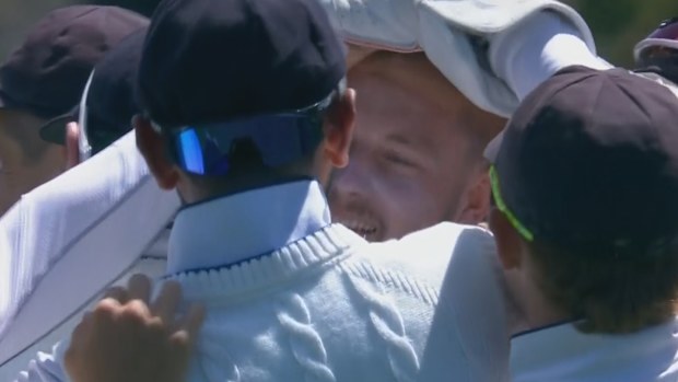 Gus Atkinson celebrates taking a hat-trick for England in the second Test against New Zealand.
