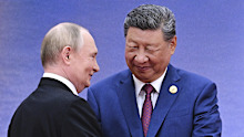 Russian President Vladimir Putin, left, and Chinese President Xi Jinping greet each other at a ceremony to welcome Heads of States of the Shanghai Cooperation Organization (SCO) summit in Tianjin, China, Sunday, Aug. 31, 2025. (Sergei Bobylev, Sputnik, Kremlin Pool Photo via AP)