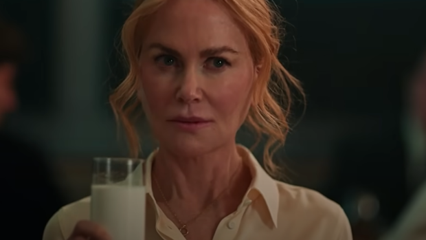 Nicole Kidman drinks a glass of milk in a scene from Babygirl
