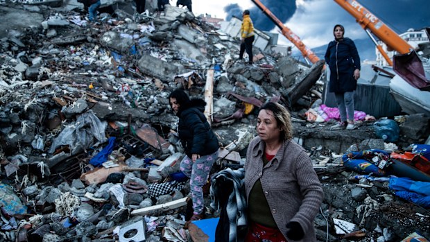 Earthquake survivors wait for news of their loved ones, believed to be trapped under collapsed building  in Iskenderun, Turkey. 