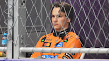 Oscar Piastri watches on after crashing out. 