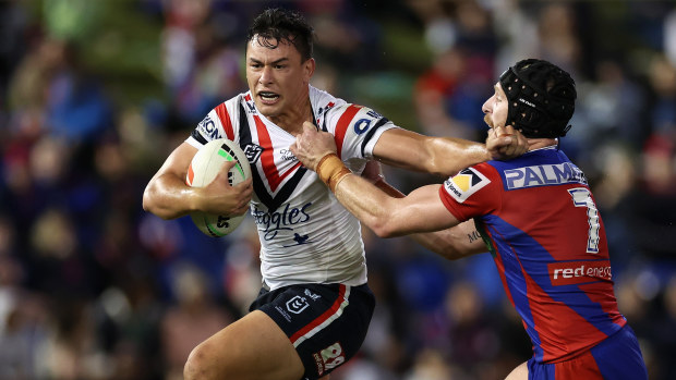 Joey Manu of the Roosters is tackled during the round six NRL match against Newcastle Knights.