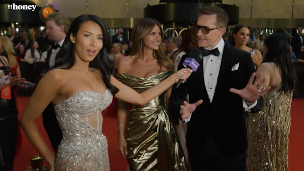 Evelyn Ellis with John Aiken and Alessandra Rampolla on the Logies red carpet.