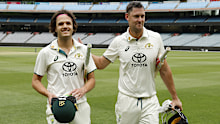 Sam Konstas and Beau Webster walk off after Australia A's victory. 