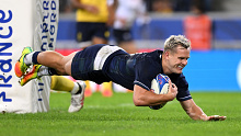 Darcy Graham of Scotland scores the team's 12th try during the Rugby World Cup match against Romania.