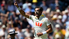 Mitchell Starc takes a wicket.