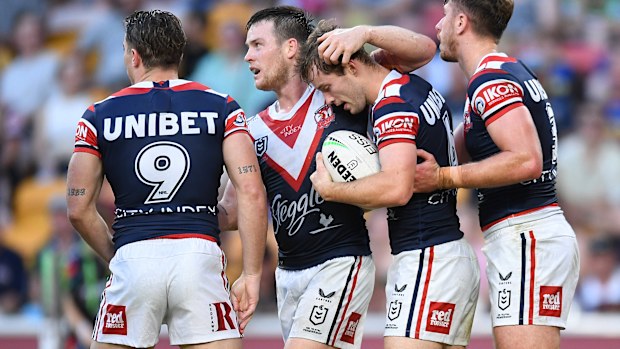 Sam Walker of the Roosters celebrates with teammate Luke Keary.
