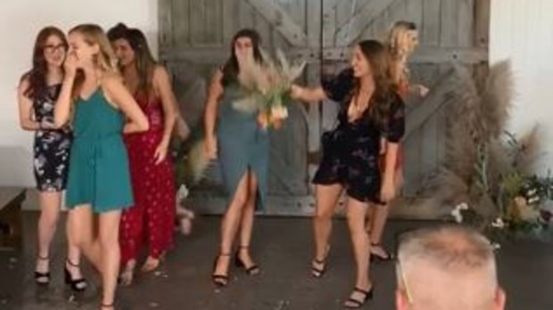 Wedding guest viciously rips the bouquet from another woman's hand