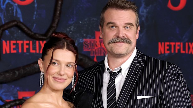 HOLLYWOOD, CALIFORNIA - NOVEMBER 06: (L-R) Millie Bobby Brown and David Harbour attend the Los Angeles Premiere of Netflix's "Stranger Things" Season 5 at TCL Chinese 6 Theatres on November 06, 2025 in Hollywood, California. (Photo by Kevin Winter/Getty Images)