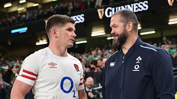 Owen Farrell of England speaks with Andy Farrell of Ireland.