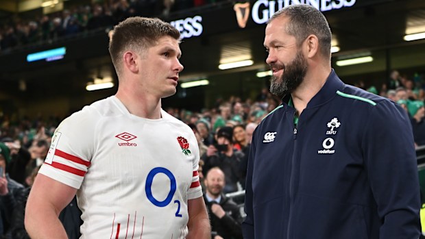 Owen Farrell of England speaks with Andy Farrell of Ireland.