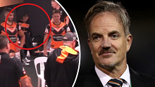Tigers CEO Justin Pascoe (right) and circled (left) in the dressing room during the club's loss to the Broncos.