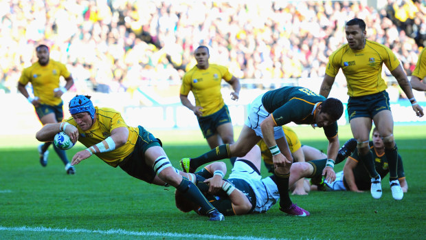 James Horwill of Australia goes over the line to score in Wellington.