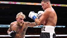 Jake Paul lands a blow on Nate Diaz in their pro boxing bout.