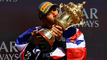 Race winner Lewis Hamilton of Great Britain and Mercedes celebrates on the podium during the F1 Grand Prix of Great Britain at Silverstone Circuit.