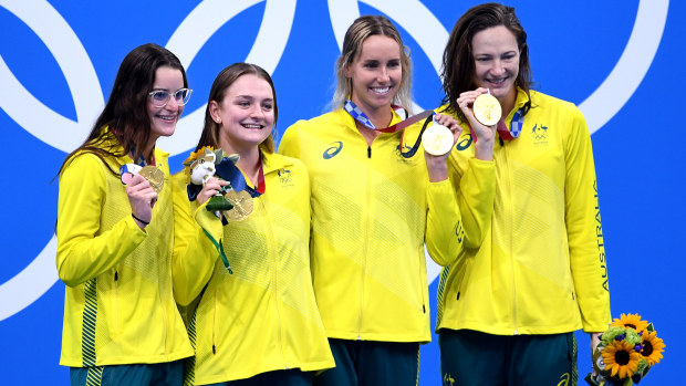 Australia's women's medley relay team pose with their gold medal.
