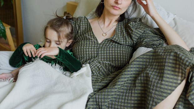 Tired mum with her child.