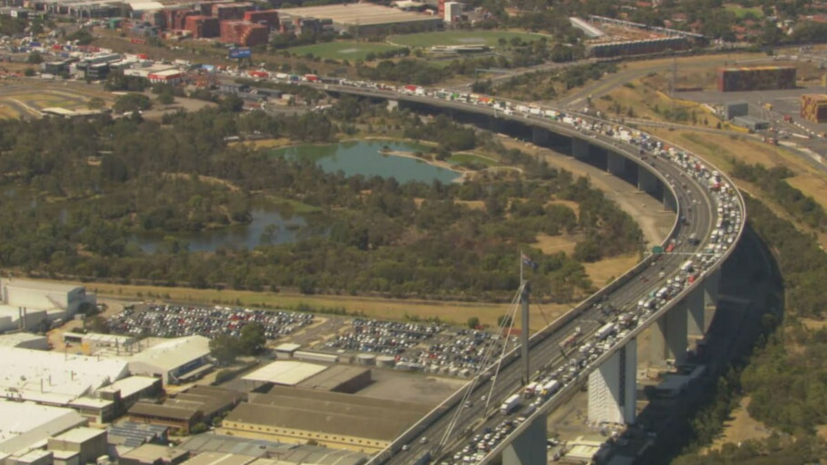 Two hospitalised as crash causes traffic chaos on Melbourne's West Gate ...